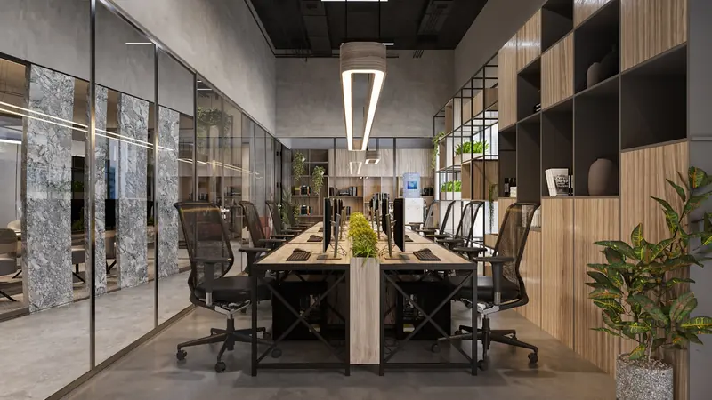 A finished open-plan office with glass partitions, desking and pendant lighting